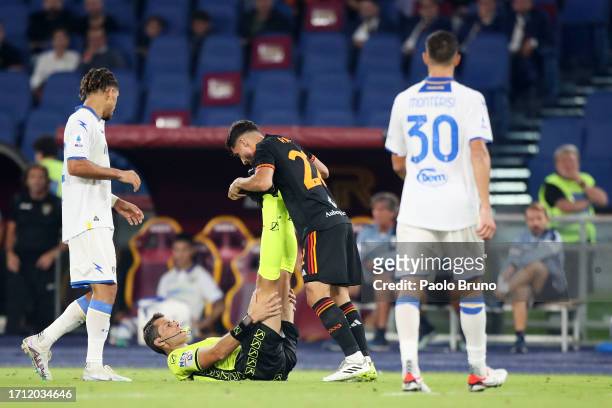 Referee, Matteo Marchetti is helped by Houssem Aouar of AS Roma after an injury during the Serie A TIM match between AS Roma and Frosinone Calcio at...