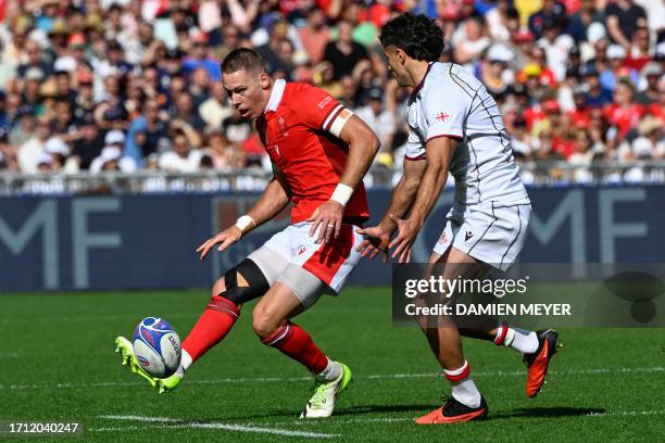 Wales' full-back Liam Williams chips the ball past Georgia's wing Davit Niniashvili during the France 2023 Rugby World Cup Pool C match between Wales...