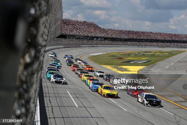 Aric Almirola, driver of the Smithfield Ford, Joey Logano, driver of the Shell Pennzoil Ford, and Riley Herbst, driver of the Beast Unleashed White...