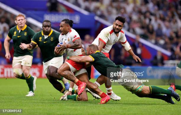 Sonatane Takulua of Tonga is tackled by Duane Vermeulen of South Africa during the Rugby World Cup France 2023 match between South Africa and Tonga...