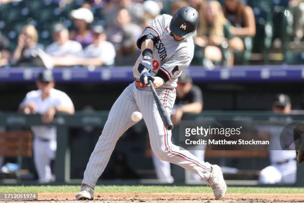 Alex Kirilloff of the Minnesota Twins hits a RBI single against the Colorado Rockies in the second inning at Coors Field on October 01, 2023 in...