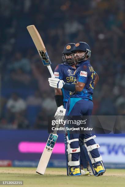 Kusal Perera of he Sri Lanka and Kusal Mendis of the Sri lanka elebrates after scoring a fifty during the ICC Men's Cricket World Cup India 2023...