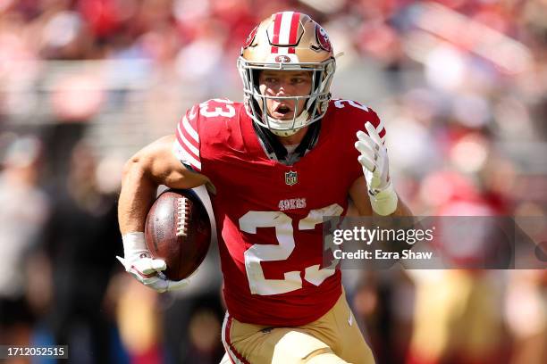 Christian McCaffrey of the San Francisco 49ers runs with the ball against the Arizona Cardinals at Levi's Stadium on October 01, 2023 in Santa Clara,...