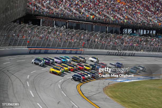 Aric Almirola, driver of the Smithfield Ford, Joey Logano, driver of the Shell Pennzoil Ford, and Riley Herbst, driver of the Beast Unleashed White...