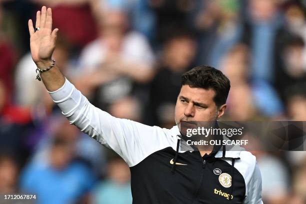 Chelsea's Argentinian head coach Mauricio Pochettino waves to fans ahead of kick off in the English Premier League football match between Burnley and...