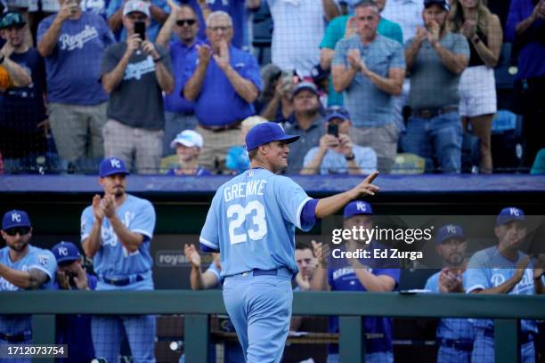 Zack Greinke of the Kansas City Royals waves to the crowd as he leaves the game after pitching against the New York Yankees in the sixth inning at...