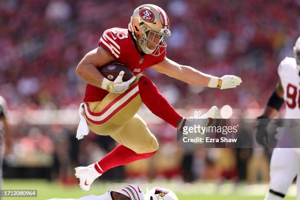 Christian McCaffrey of the San Francisco 49ers runs with the ball against the Arizona Cardinals during the first half at Levi's Stadium on October...