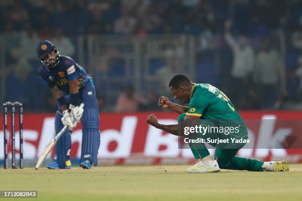 Kagiso Rabada of the South Africa celebrates after taking the wicket of Kusal Mendis of the Sri lanka during the ICC Men's Cricket World Cup India...