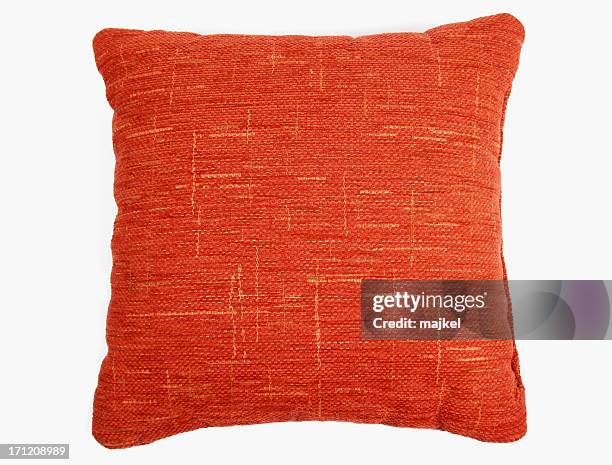 red-orange square couch pillow with yellow design  - cushion stockfoto's en -beelden