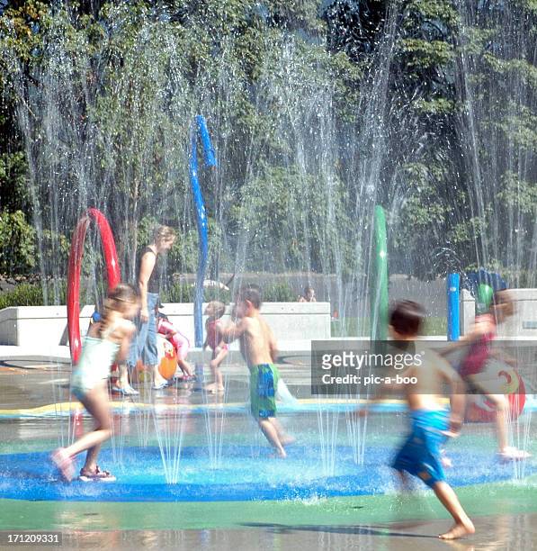 water park - girls and boys playing in waterpark stock-fotos und bilder