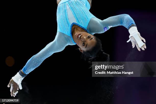 Simone Biles of Team United States in action on Uneven Bars during Women's Qualifications on Day Two of the FIG Artistic Gymnastics World...