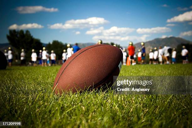 football practice - american football ball stock pictures, royalty-free photos & images