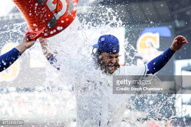 Eugenio Suarez of the Seattle Mariners is doused with water after the Seattle Mariners beat the Texas Rangers 1-0 at T-Mobile Park on October 01,...