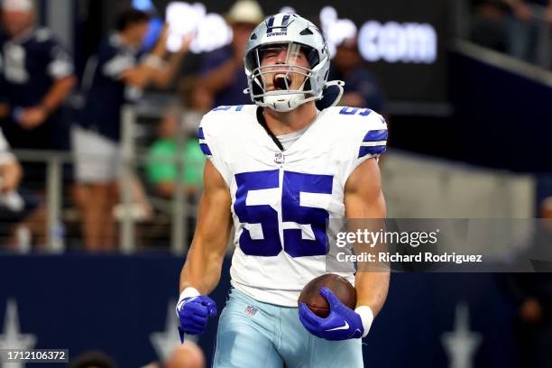 Leighton Vander Esch of the Dallas Cowboys celebrates after returning a fumble for a touchdown during the second quarter against the New England...