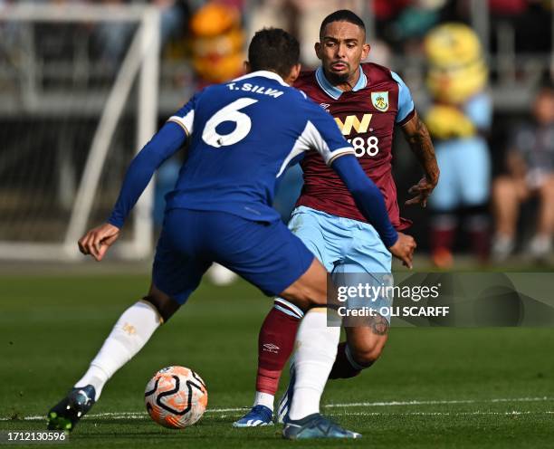 Burnley's Brazilian defender Vitinho nutmegs Chelsea's Brazilian defender Thiago Silva during the English Premier League football match between...