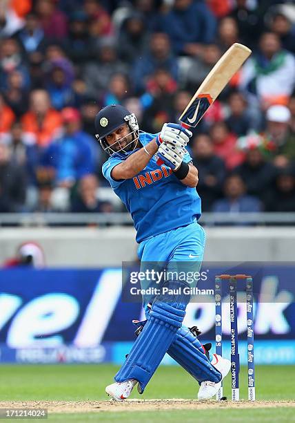 Virat Kohli of India hits out during the ICC Champions Trophy Final match between England and India at Edgbaston on June 23, 2013 in Birmingham,...