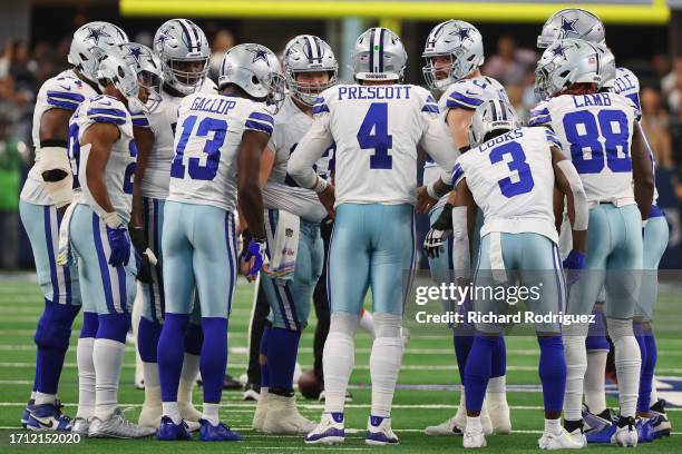 Dak Prescott of the Dallas Cowboys huddles his team during the first half against the New England Patriots at AT&T Stadium on October 01, 2023 in...