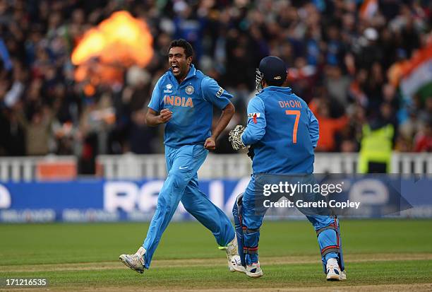 Ravichandran Ashwin of India celebrates the wicket of Joe Root of England with Mahendra Singh Dhoni during the ICC Champions Trophy Final between...