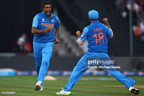 Ravichandran Ashwin of India celebrates with Virat Kohli after taking the wicket of Joe during the ICC Champions Trophy Final match between England...
