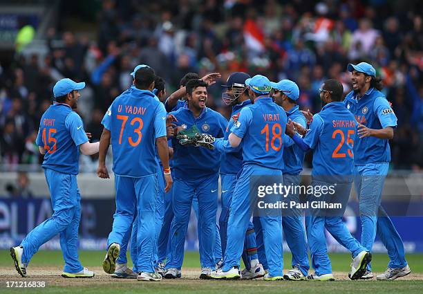 India celebrate taking the wicket of Ian Bell of England after he was stumped by MS Dhoni of India off the bowling of Ravindra Jadeja of India during...