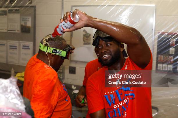 Yordan Alvarez of the Houston Astros celebrates with manager Dusty Baker Jr. #12 after the Astros defeated the Arizona Diamondbacks 8-1 to win the...