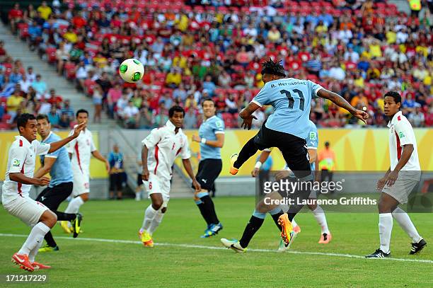 Abel Hernandez of Uruguay hits a header to score a goal in the 2nd minute against Tahiti during the FIFA Confederations Cup Brazil 2013 Group B match...