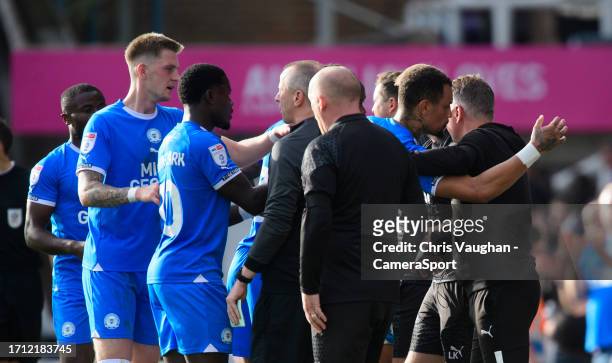 Peterborough United's Jonson Clarke-Harris hugs Peterborough United manager Darren Ferguson as their side celebrate the opening goal, scored by David...