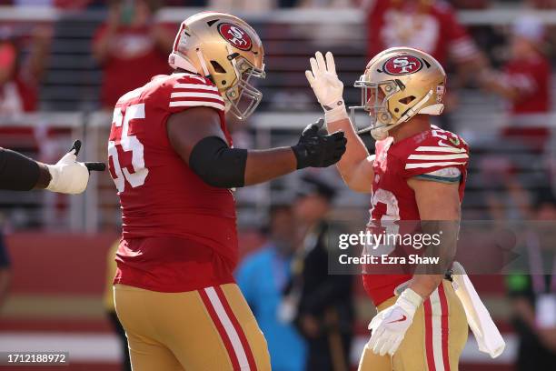 Christian McCaffrey of the San Francisco 49ers celebrates his fourth touchdown against the Arizona Cardinals at Levi's Stadium on October 01, 2023 in...