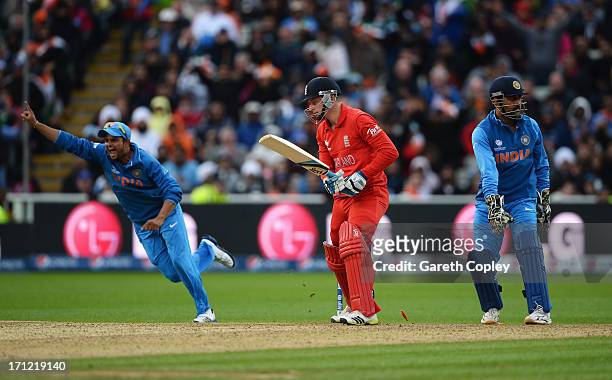 Jos Buttler of England is bowled by Ravindra Jadeja of India as Suresh Raina celebrates during the ICC Champions Trophy Final between England and...
