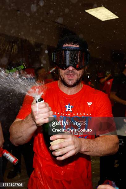 Alex Bregman of the Houston Astros celebrates after the Astros defeated the Arizona Diamondbacks 8-1 to win the American League West division title...