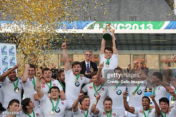 Captain Jack Clifford of England lifts the trophy after receiving it from IRB President, Bernard Lapasset during the 2013 IRB Junior World...