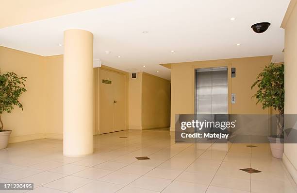 modern corporate lobby - elevator doors stock pictures, royalty-free photos & images