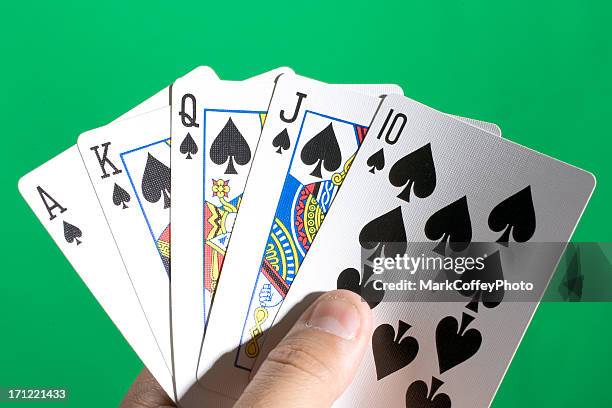 holding a royal flush - royal flush stock pictures, royalty-free photos & images
