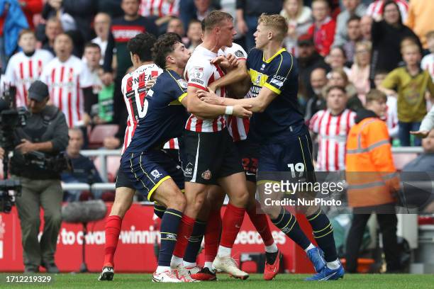 Players scuffle after a disagreement by Dan Ballard of Sunderland and Josh Coburn Of Middlesbrough during the Sky Bet Championship match between...