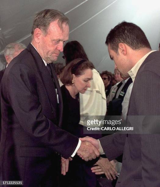 Canadian Prime Minister Jean Chretien and his wife Aline shakes hands with family members of victims of Swissair crash 111 after a memorial service...