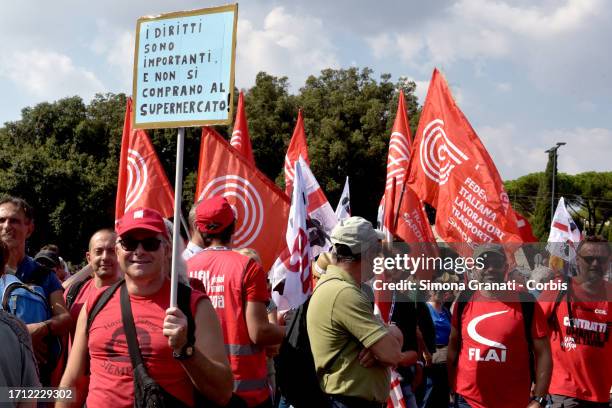 People with a sign that says: rights are important and cannot be bought at the supermarket, protest in the national demonstration called by the CGIL...