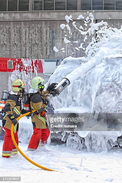 firefighters - spray nozzle stock pictures, royalty-free photos & images