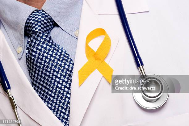 awareness - yellow ribbon stock pictures, royalty-free photos & images