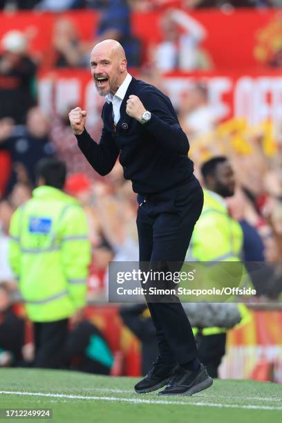 Manchester United manager Erik ten Hag celebrates their late winning goal during the Premier League match between Manchester United and Brentford FC...