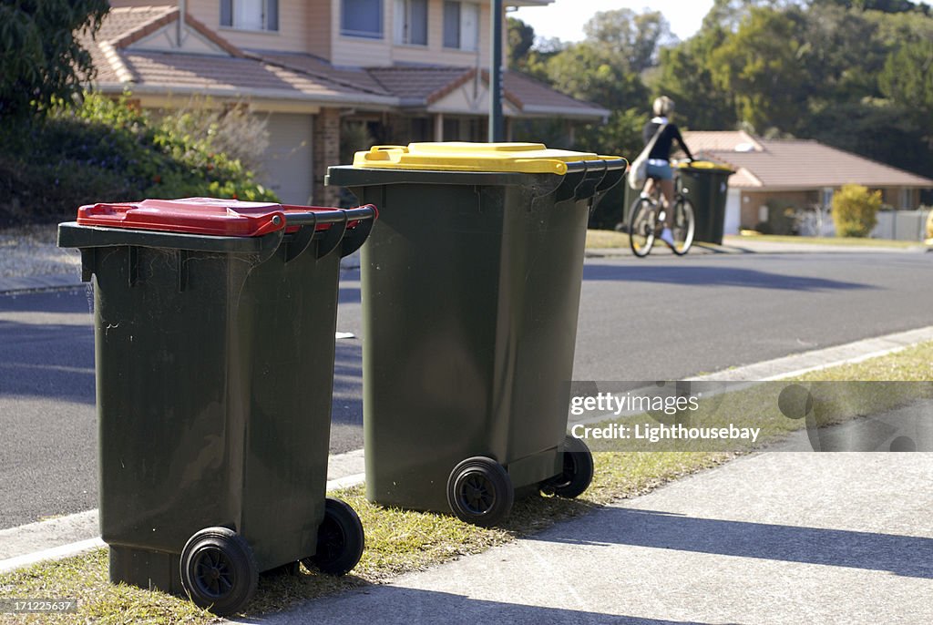 Two Australian rubbish bins Red is rubbish, yellow is recycling