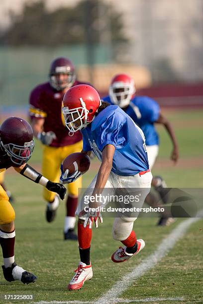 evading the tackle - tackling stock pictures, royalty-free photos & images