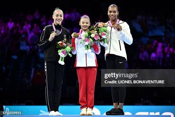 Second-placed Algeria's Kaylia Nemour, winner China's Qiyuan Qiu and ...