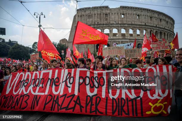 School Students hold banners and shout slogan during the national demonstration organized by Italian Labour unions CGIL on October 7, 2023 in Rome,...