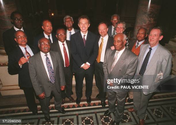 British Prime Minister Tony Blair and Foreign Secretary Robin Cook pose for a photograph at a Foreign and Commonwealth office reception, 18 June for...