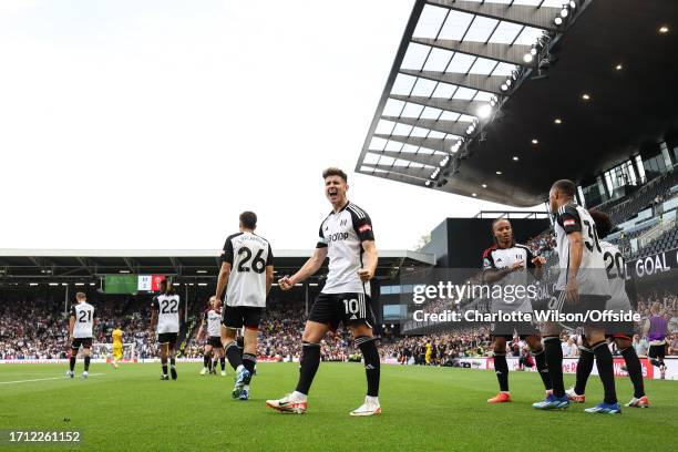 Tom Cairney of Fulham celebrates scoring their 2nd goal during the Premier League match between Fulham FC and Sheffield United at Craven Cottage on...