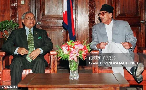 Visiting Maldives President Maumoon Abdul Gayoom and Nepalese Prime Minister Girija Prasad Koirala, share laughter as they start with their talks at...