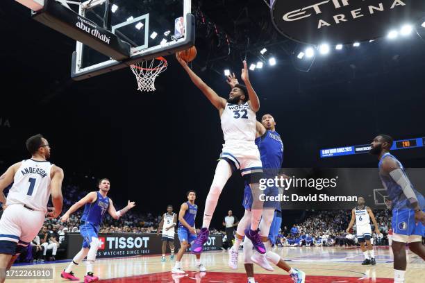 Karl-Anthony Towns of the Minnesota Timberwolves drives to the basket during the game against the Dallas Mavericks as part of the 2023 NBA Global...