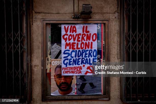 Poster where it reads, "Away with the Meloni Government, General Strike." during the national demonstration organized by Italian Labour unions CGIL...