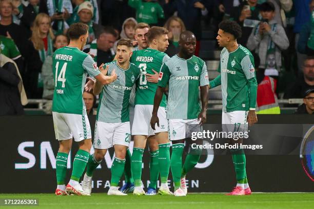 Romano Schmid of SV Werder Bremen celebrates his goal with teammates during the Bundesliga match between SV Werder Bremen and TSG Hoffenheim at...