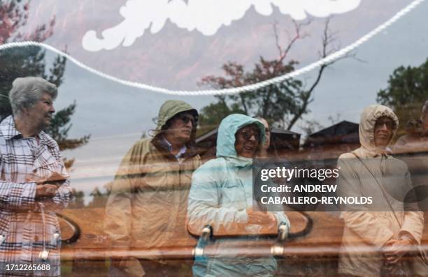 People attending the funeral of 'Stoneman Willie' are reflected in jis hearse in Reading, Pennsylvania, on October 7, 2023. "Stoneman Willie" died in...